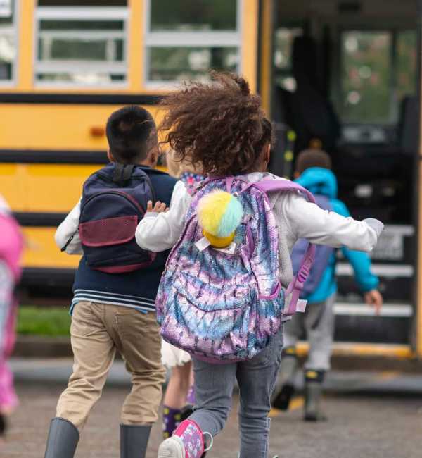 Children taking school bus near McCue Galleria in Houston Texas