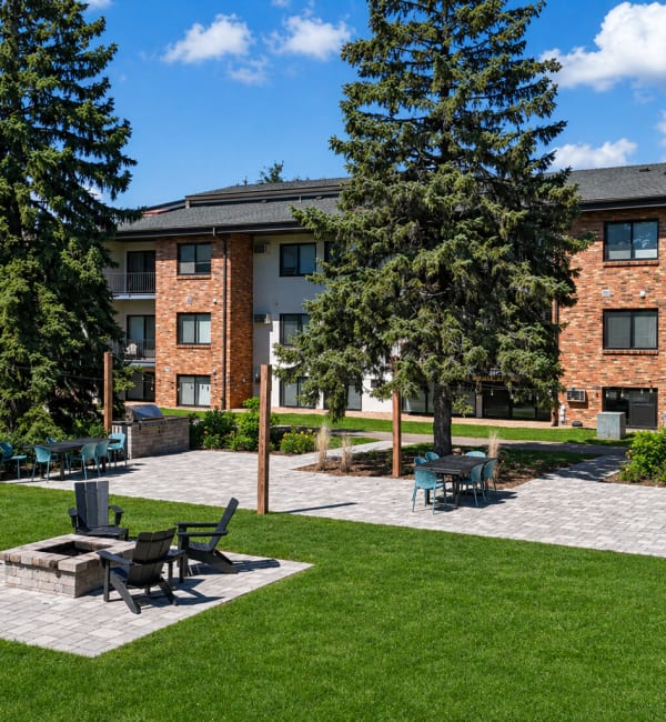 Grilling station and fireplace at Equinox Apartments in Saint Anthony, Minnesota