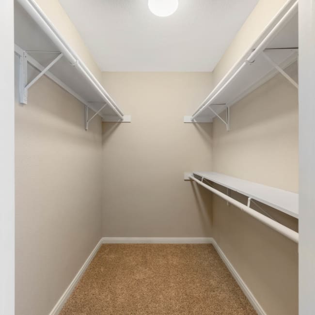 A walk in closet at Lodge @ 1550 in Katy, Texas