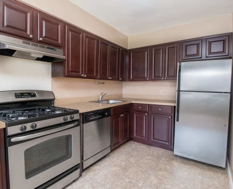 Fully equipped kitchen with stainless steel appliances in an apartment home at Scudder Falls in Ewing, New Jersey