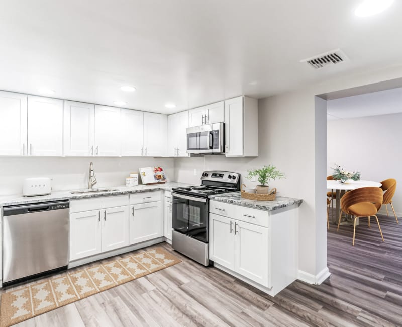 Model apartment kitchen with wood style flooring at Eagle Rock Apartments at Swampscott in Swampscott, Massachusetts