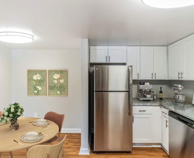 Model apartment kitchen with wood style flooring at Eagle Rock Apartments at Swampscott in Swampscott, Massachusetts