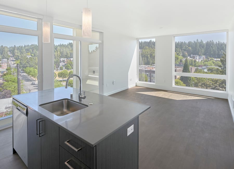 Spacious living room and kitchen at Station House Apartments in Redmond, Washington