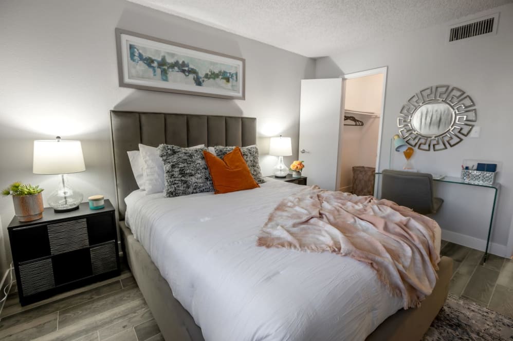 Furnished bedroom shown — representative home at The Mod Apartments.