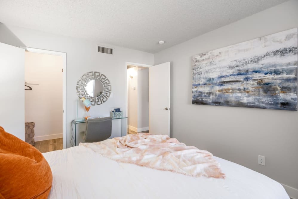 Furnished bedroom shown — representative home at The Mod Apartments.