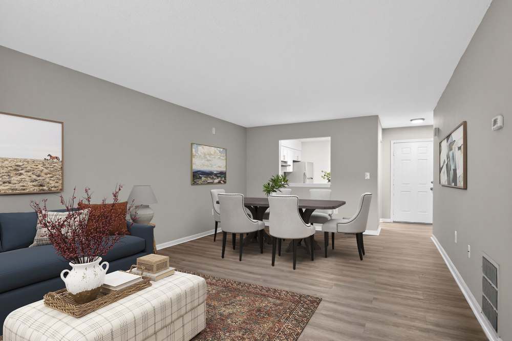 Modern living room with a view into the kitchen at The Residences at Talcott, an Eagle Rock Community in Weatogue, Connecticut