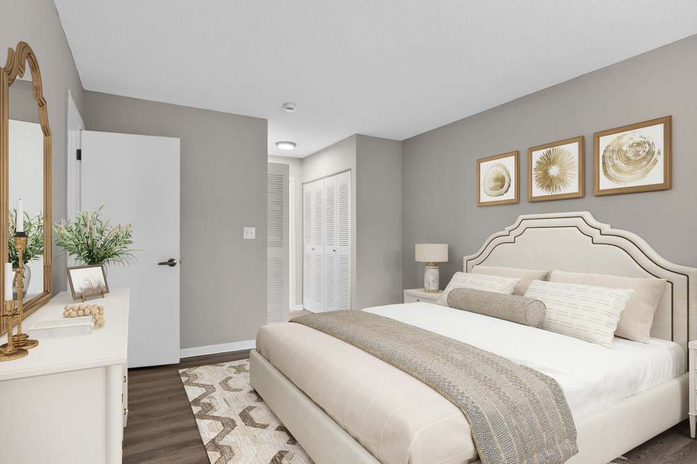 Comfortable bedroom with hardwood flooring at The Residences at Talcott in Weatogue, Connecticut