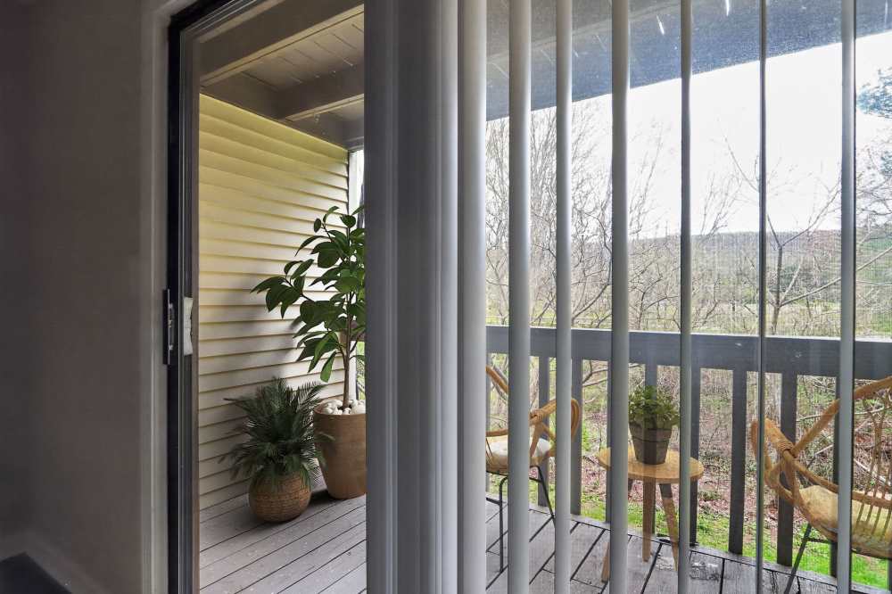 Sliding glass door to a private balcony at The Residences at Talcott, an Eagle Rock Community in Weatogue, Connecticut