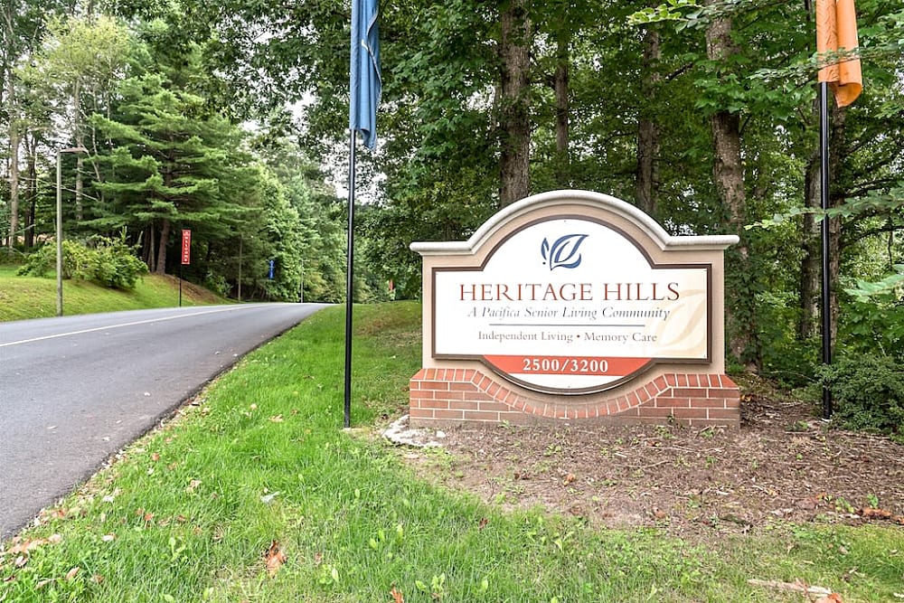 Exterior view with signage at Pacifica Senior Living Heritage Hills in Hendersonville, North Carolina
