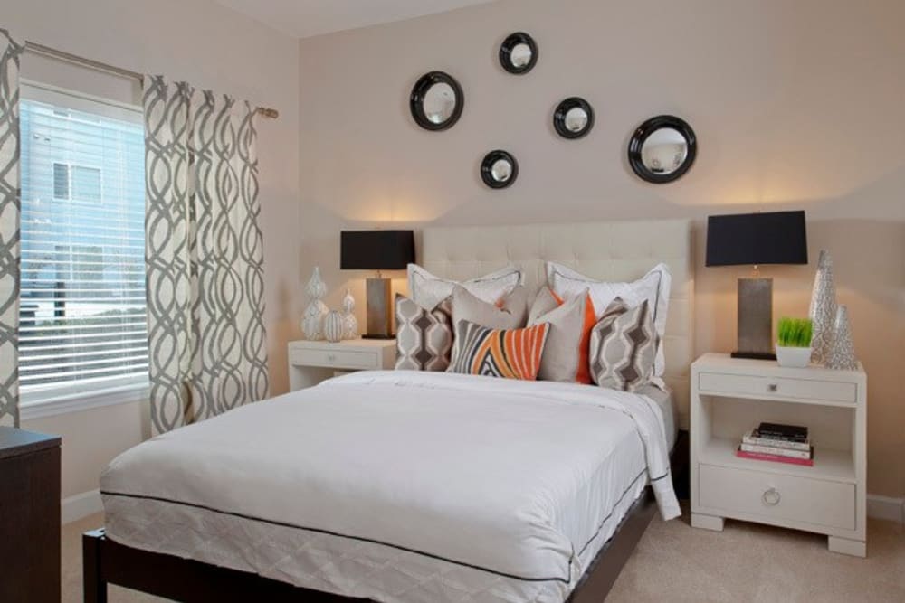 Modern furnished bedroom with lots of natural light at The Galaxy in Silver Spring, Maryland