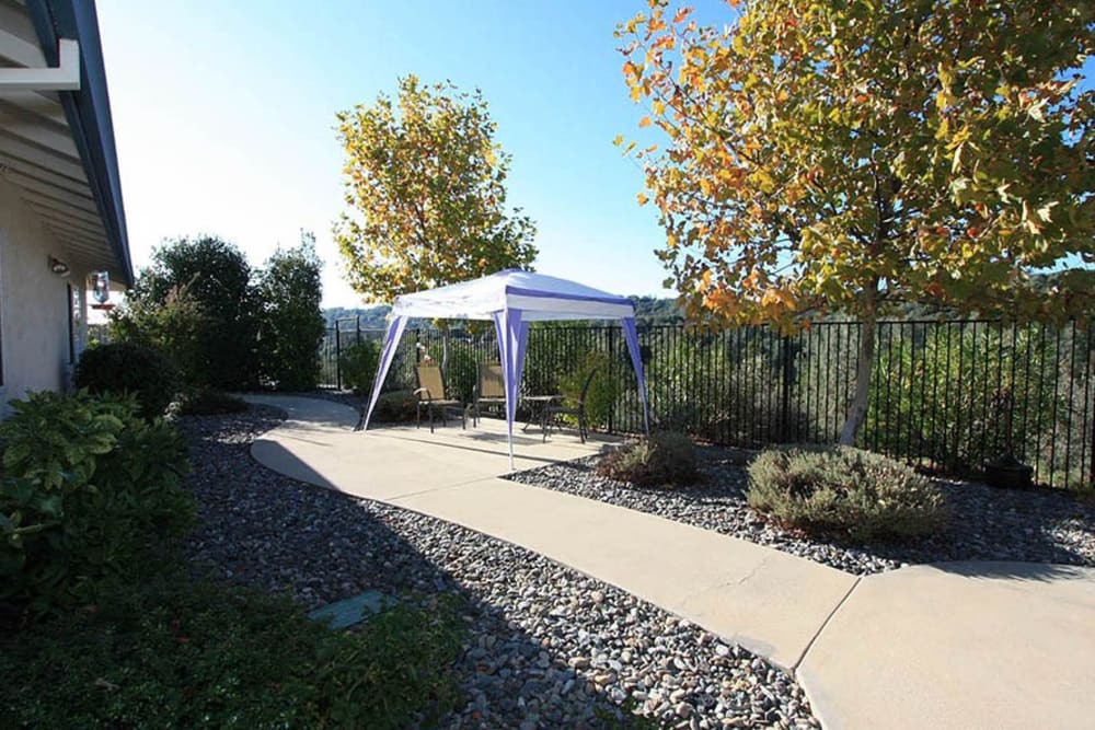 Outdoor walking area and tent at Oak Terrace Memory Care in Soulsbyville, California