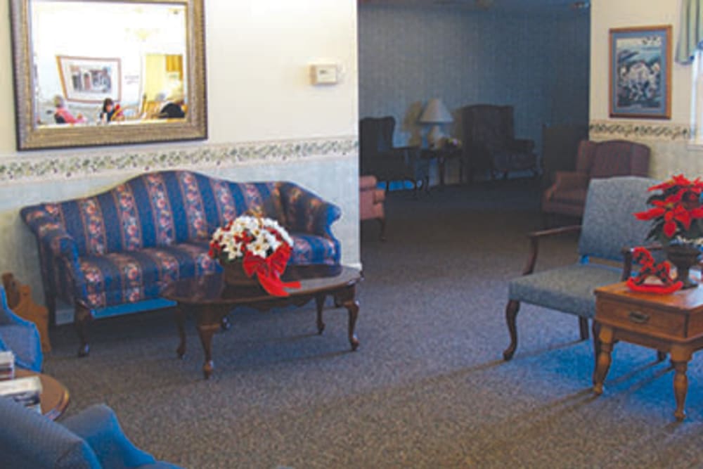 Seating area with blue chairs at Oak Terrace Memory Care in Soulsbyville, California