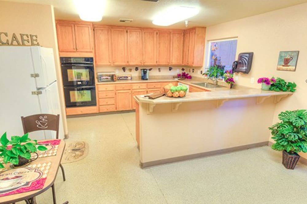 Kitchen area in residential apartment at Oak Terrace Memory Care in Soulsbyville, California