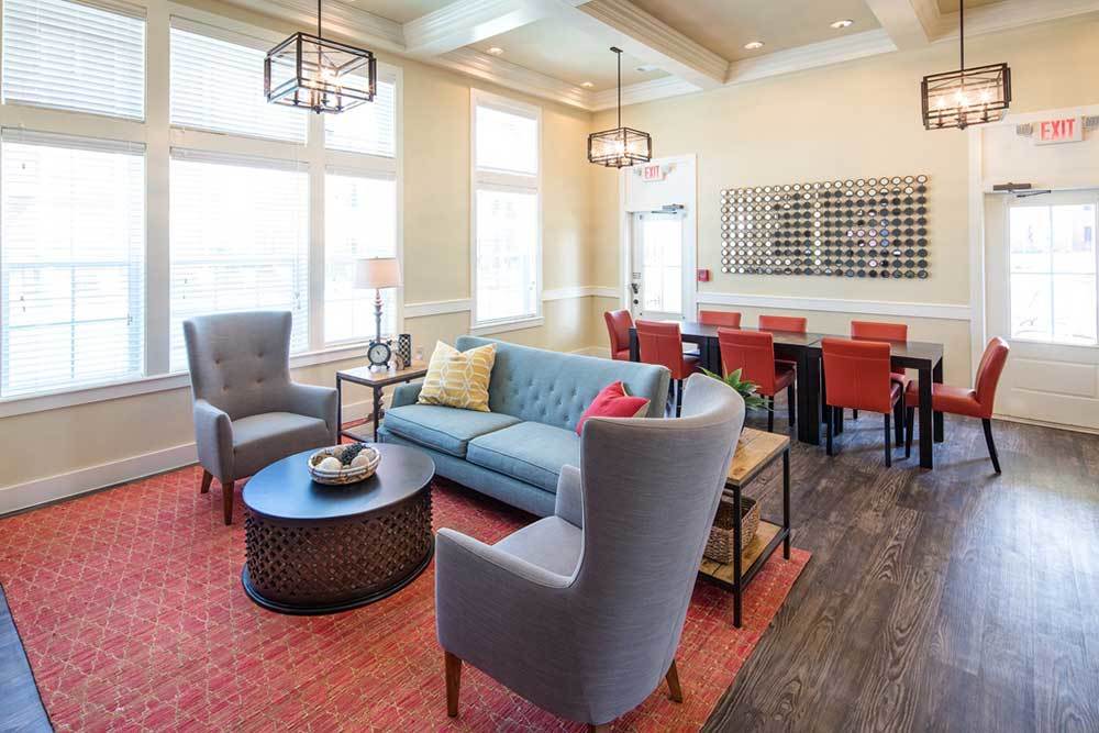 A lounge with wood-style flooring at Traditions at Mid Rivers in Cottleville, Missouri
