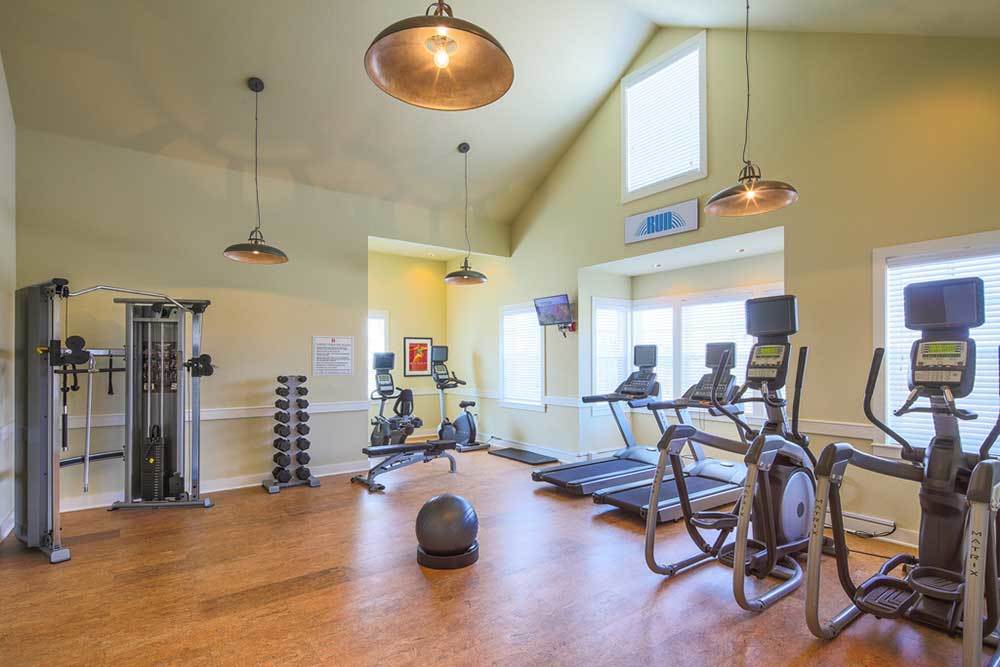 A fitness center with treadmills at Traditions at Mid Rivers in Cottleville, Missouri