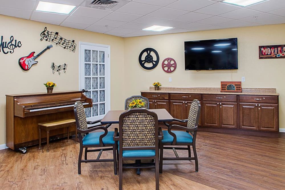 TV and piano room at Grand Villa of Lakeland in Florida