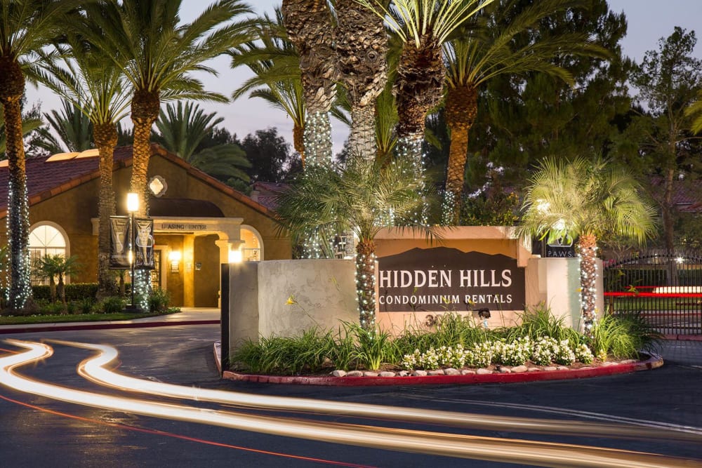 Apartment sign at dusk at Hidden Hills Condominium Rentals in Laguna Niguel, California