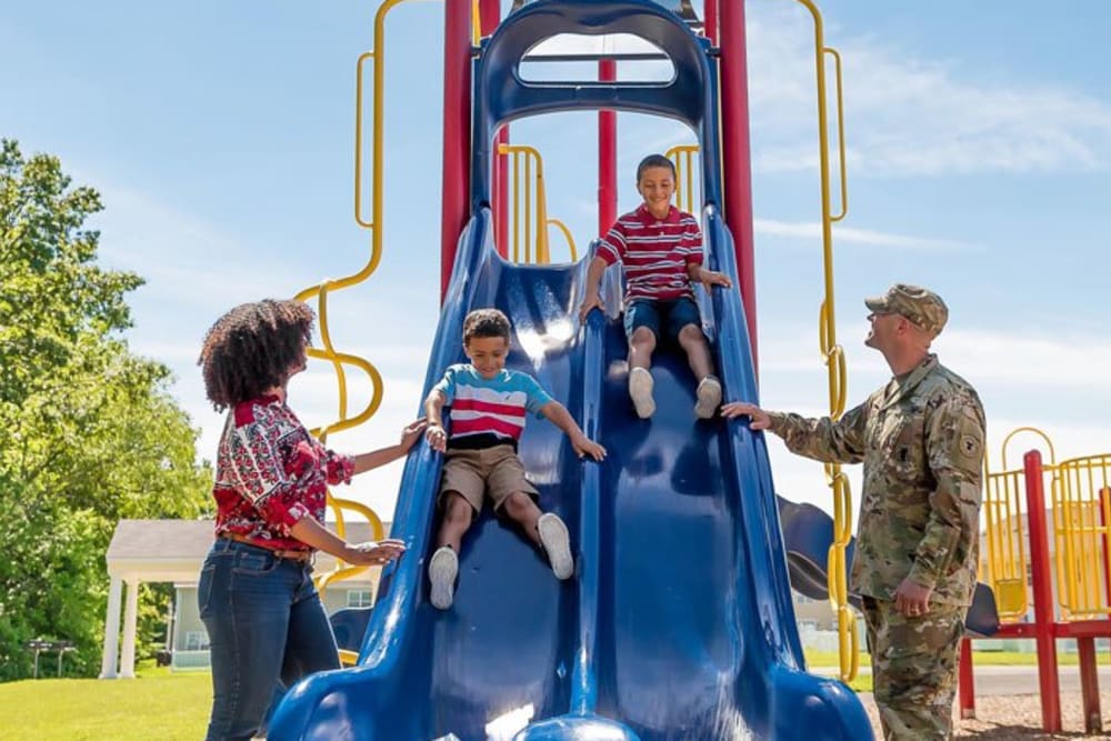 Residents playing with their kids at the park at United Communities in Joint Base MDL, New Jersey