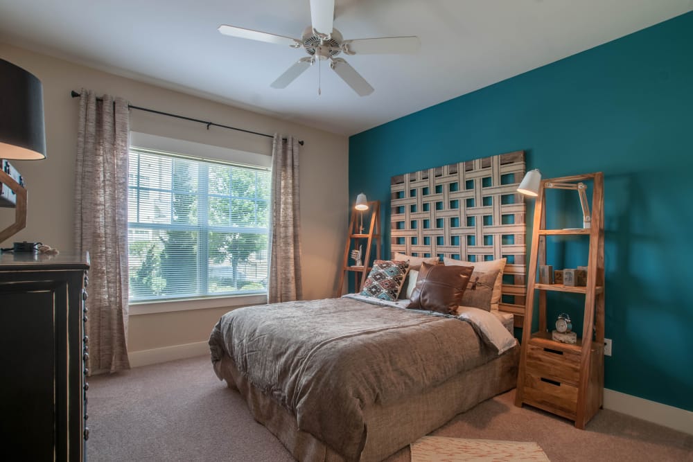 Relax in your bedroom at Riverside Parc Apartments in Atlanta, GA