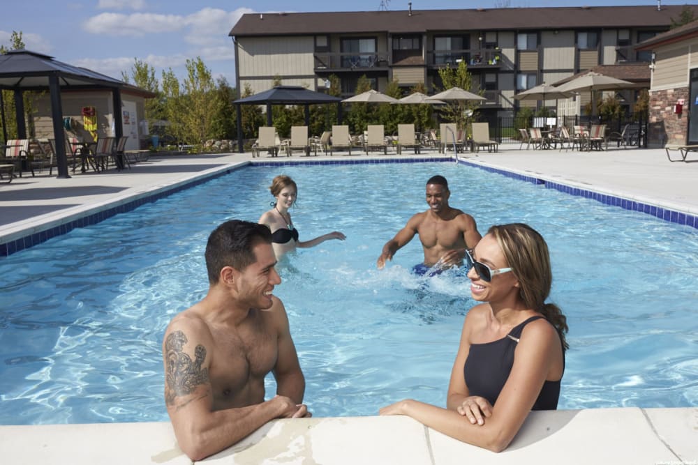 Residents in pool at The Trilogy Apartments in Belleville