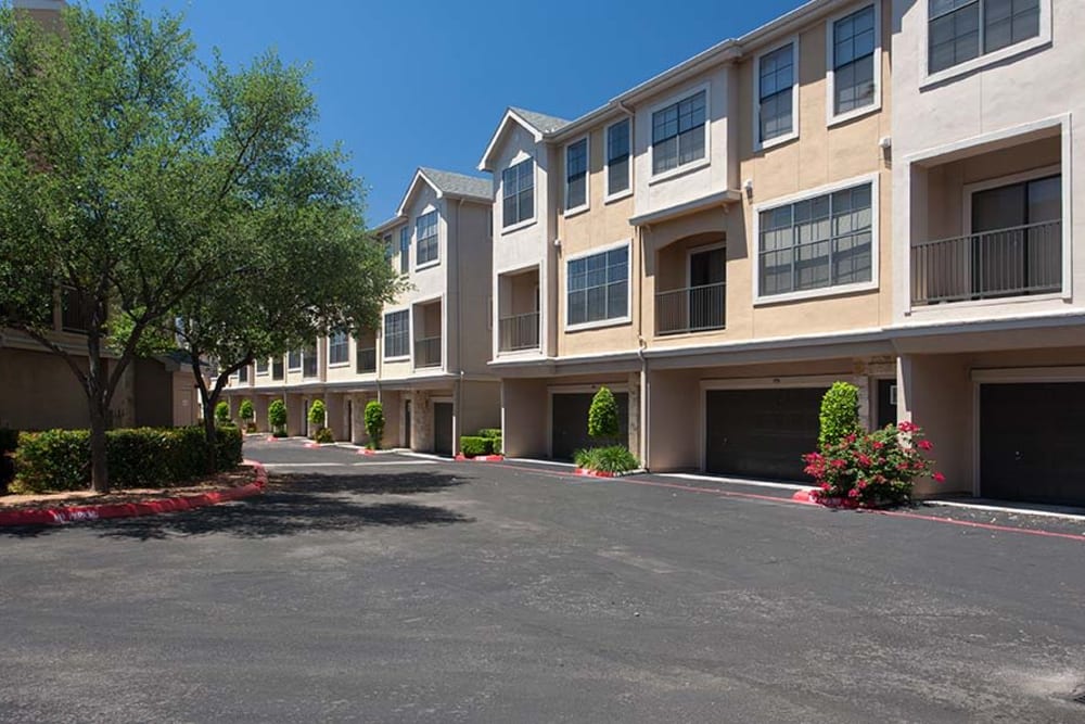 Exterior parking spaces and garages at The Quarry Townhomes in San Antonio, Texas