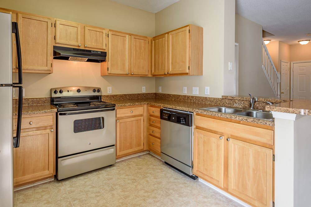 Kitchen with full appliance package at Falls Creek Apartments & Townhomes in Raleigh, North Carolina