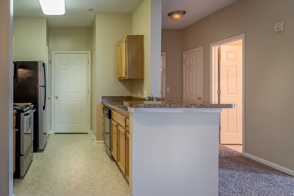 Kitchen with breakfast bar at Falls Creek Apartments & Townhomes in Raleigh, North Carolina
