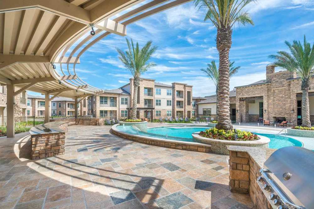 Resort-style pool at The Abbey at Spring Town Center in Spring, Texas