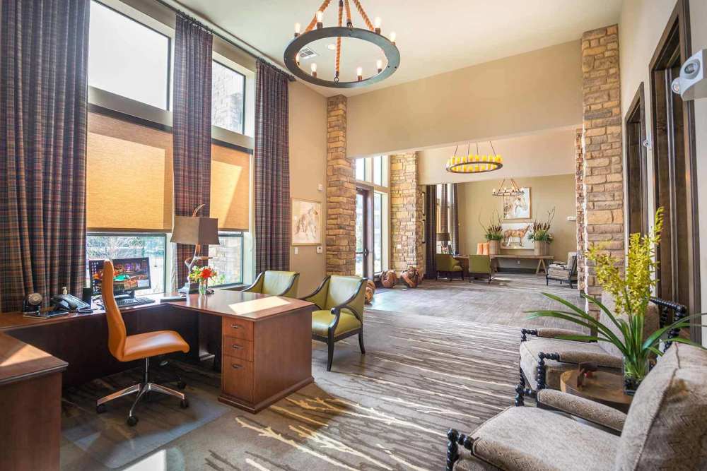 Luxurious lounge with lots of seating and indoor plants at The Abbey at Spring Town Center in Spring, Texas