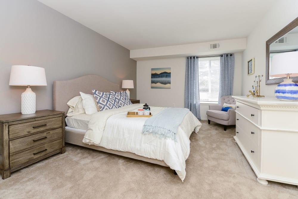 Model bedroom with plush carpeting at Country Village Apartment Homes in Dover, Delaware