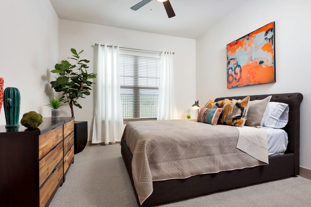 Bedroom with ceiling fan at Villas at the Rim