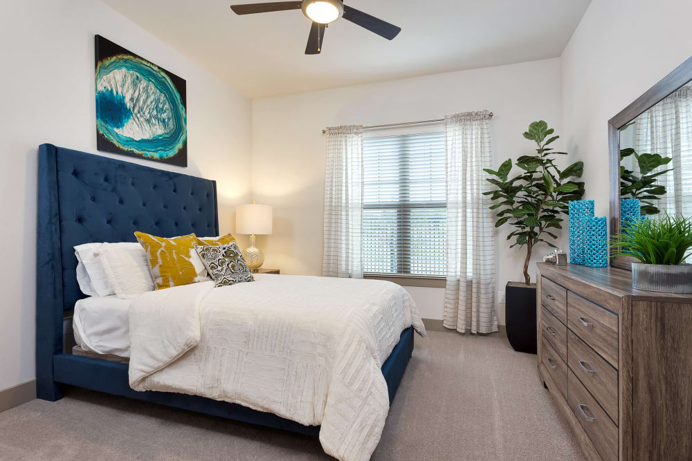 Bedroom with ceiling fan at Villas at the Rim