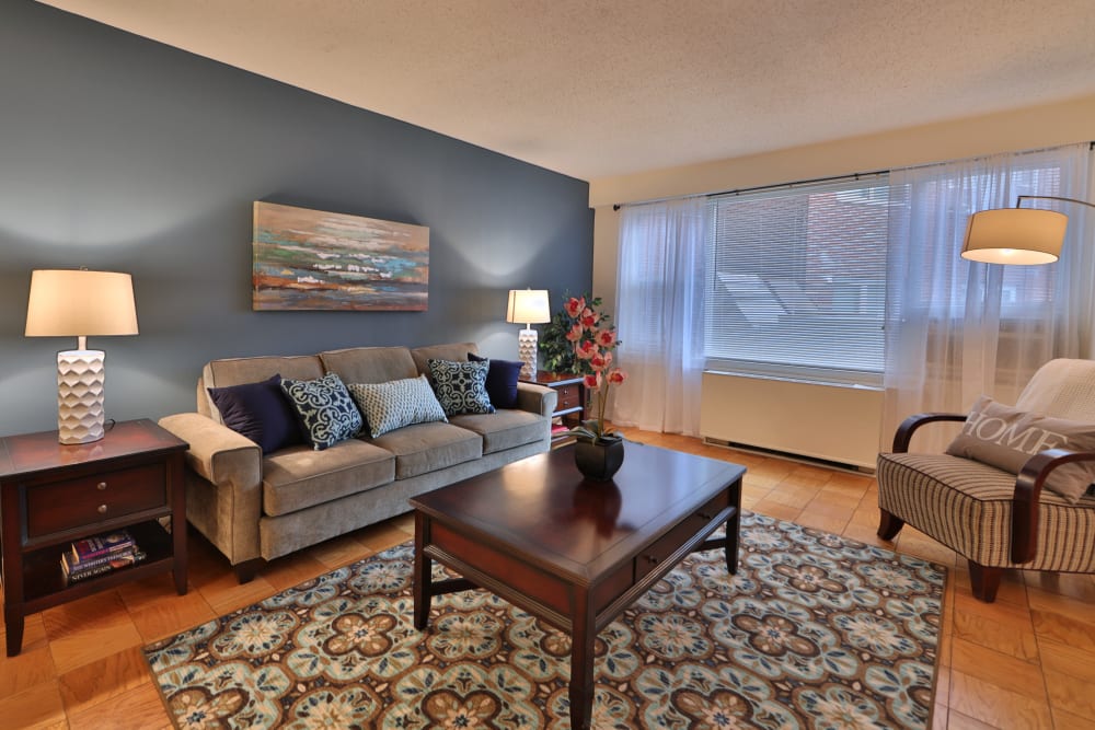 A furnished living room in a home at The Carlyle Apartments in Baltimore, Maryland