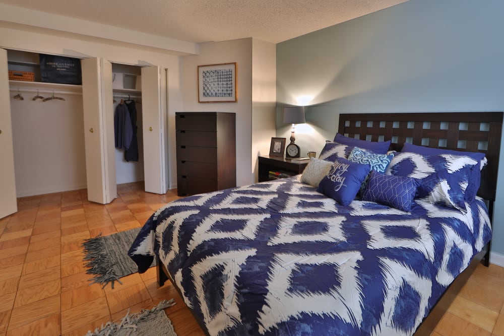 A furnished bedroom in a home at The Carlyle Apartments in Baltimore, Maryland