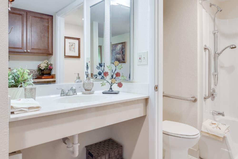 Bathroom with cabinets at Grand Villa of Boynton Beach in Boynton Beach, Florida