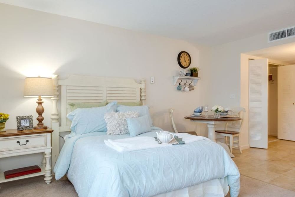 Cozy bedroom with ensuite bathroom at Grand Villa of Delray West in Delray Beach, Florida