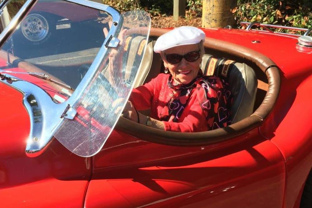 Resident sitting in his convertible car at Shorewood Senior Living in Florence, Oregon