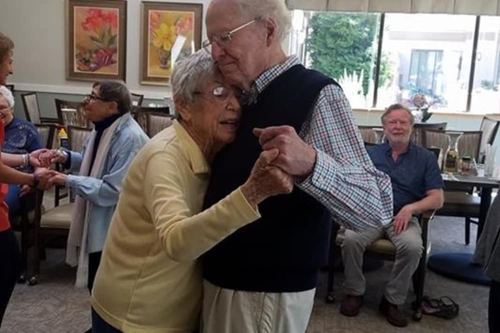 Resident couple dancing together at Shorewood Senior Living in Florence, Oregon
