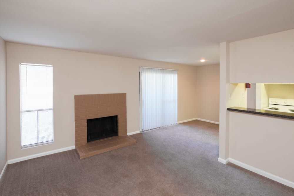 unfurnished living room with fireplace at Morgan Bay in Houston, Texas