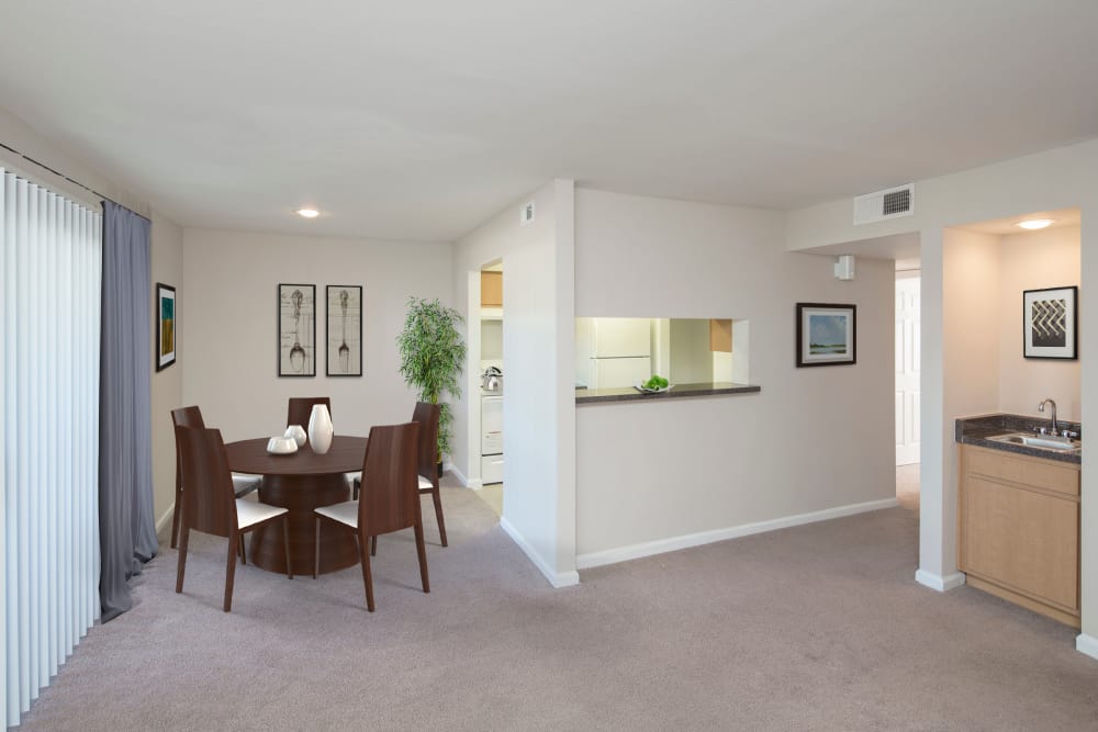 model furnished living room and dining area at Morgan Bay in Houston, Texas