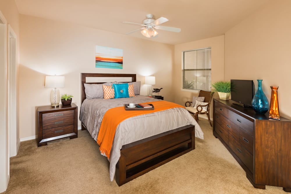 Bedroom with ceiling fan at Villas on Hampton Avenue