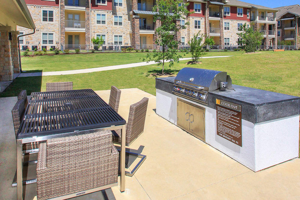 Ramada with picnic table and barbeque at Estates of Richardson