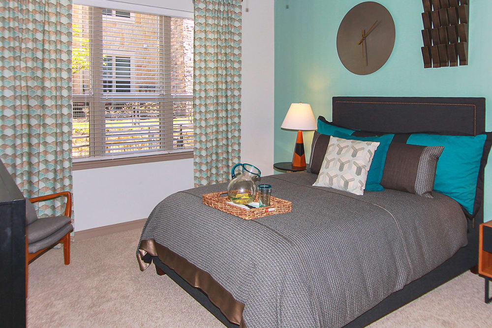 Spacious bedroom with large window at Estates of Richardson in Richardson, Texas