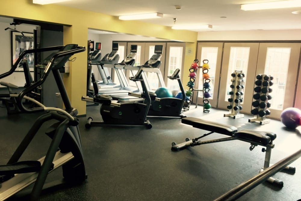 A fitness center with individual workout stations at Loring Park Apartments in Minneapolis, Minnesota