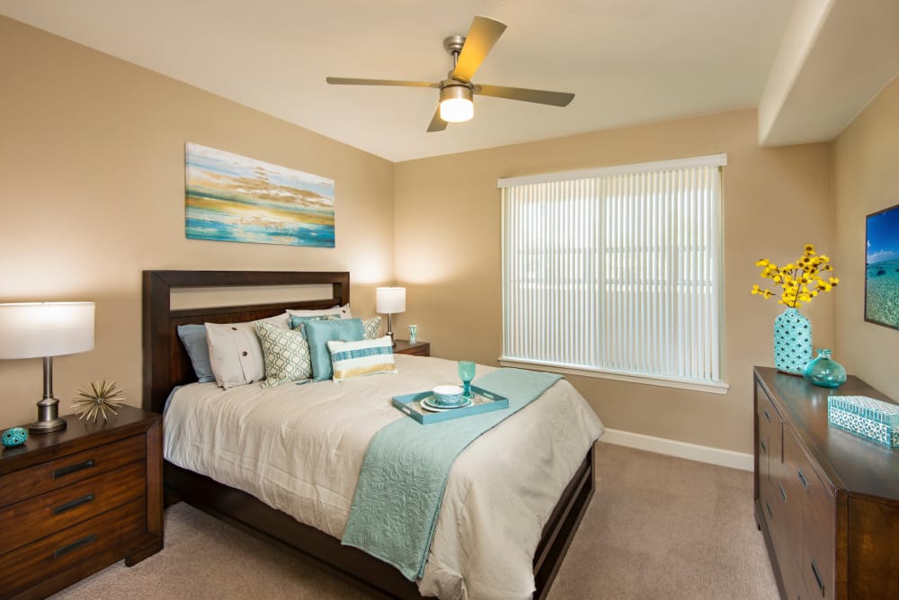 Bedroom with ceiling fan and light at Southern Avenue Villas