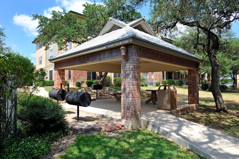 Pavilion with picnic tables and barbeque at The Estates of Northwoods