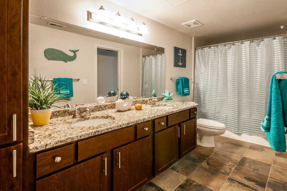 Bathroom with large vanity mirror at The Lodge at Westover Hills in San Antonio, Texas