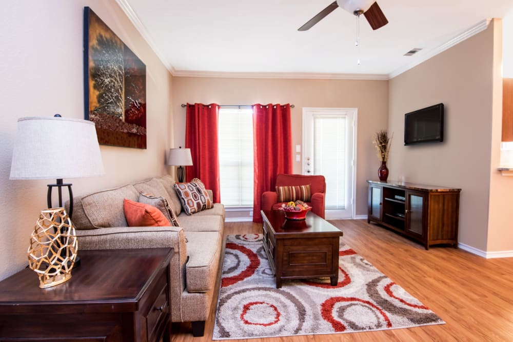 Living room with ceiling fan at Villas of Preston Creek