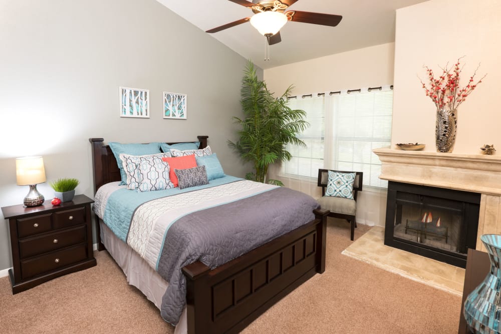 Bedroom with fireplace at Villas at Parkside