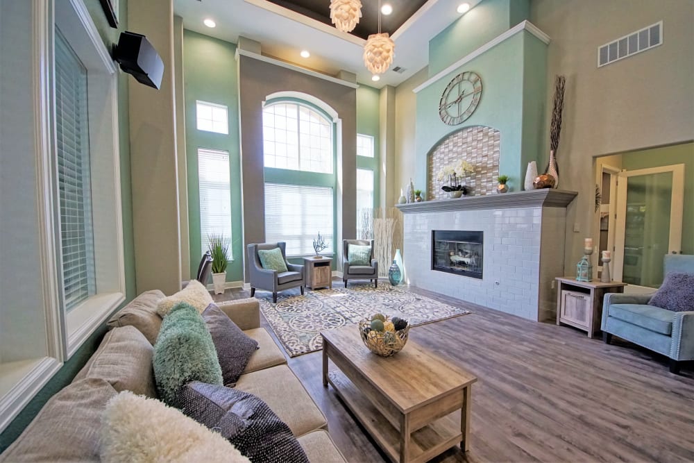 a spacious clubhouse with a fireplace at Reserve at Centerra Apartment Townhomes in Loveland, Colorado